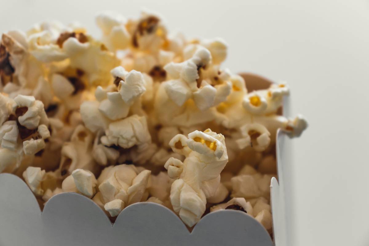 Essential popcorn accessories for popcorn maker including measuring scoops, stirring paddles, and serving bowls